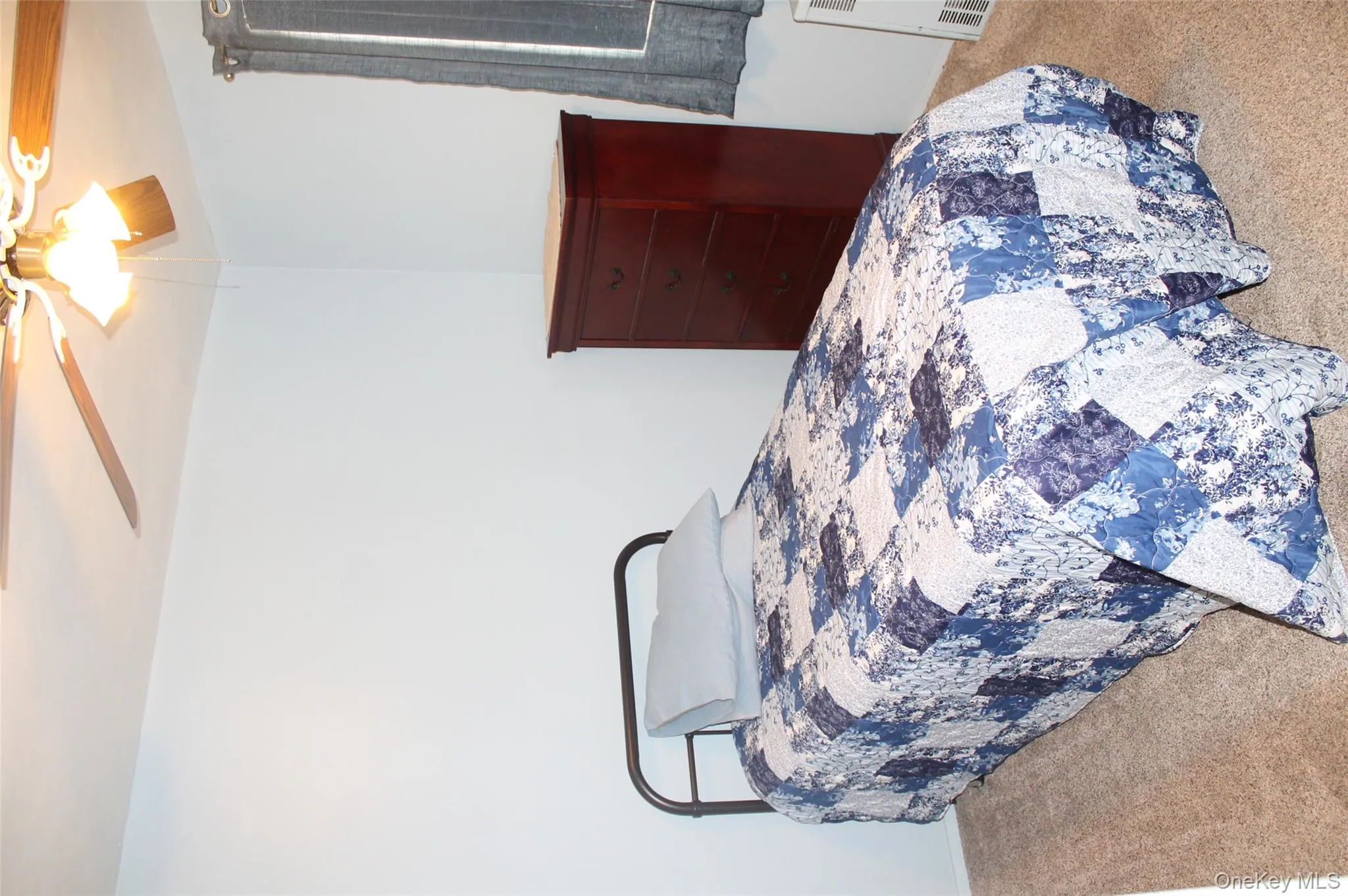 Bedroom featuring carpet and ceiling fan Bedroom featuring carpet and ceiling fan