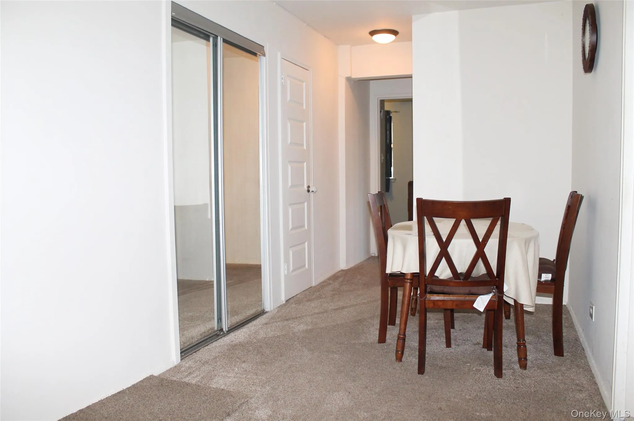 Dining space featuring light colored carpet Dining space featuring light colored carpet