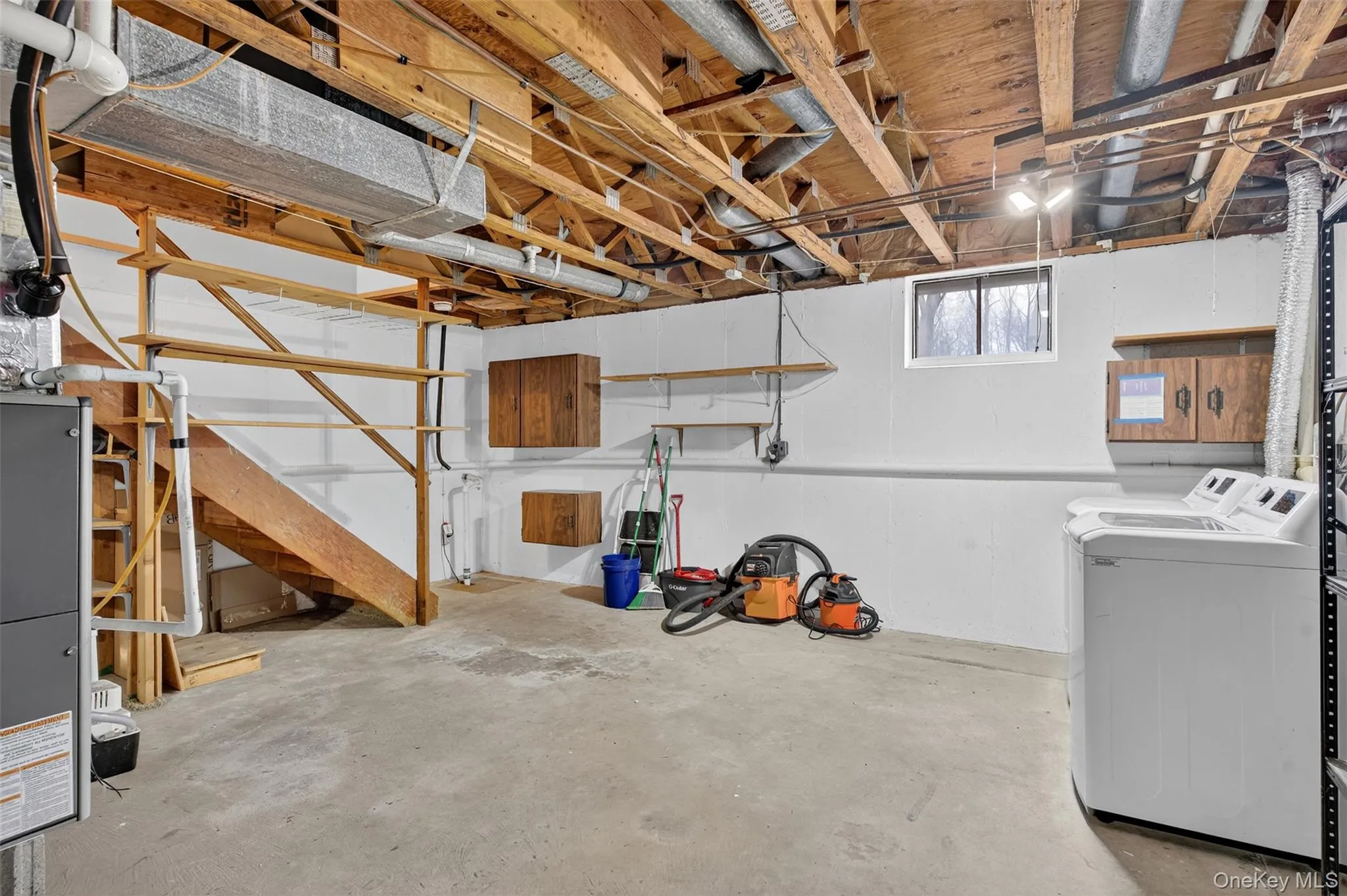 Below grade area with washing machine and dryer Below grade area with washing machine and dryer