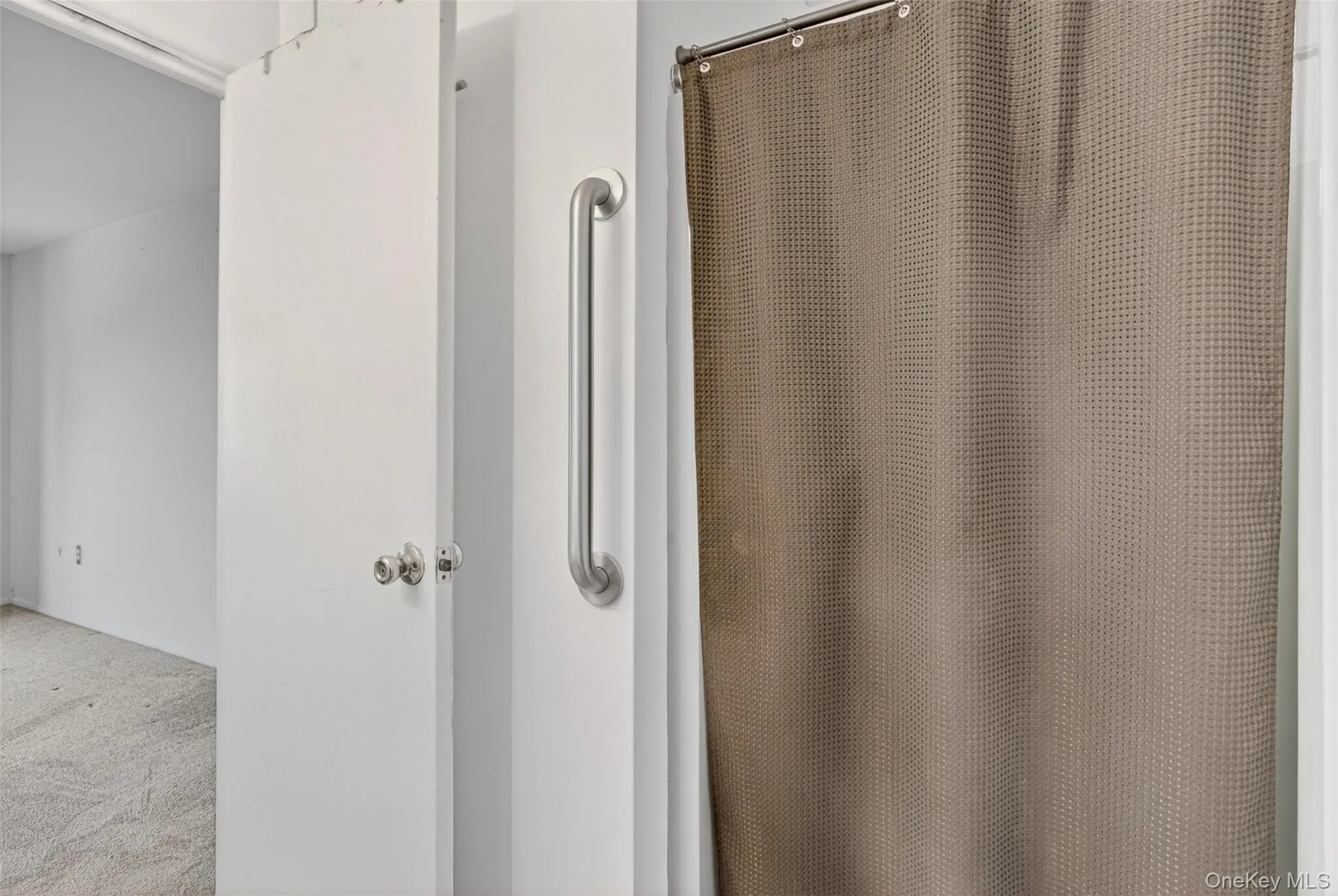 Full bath with a shower with curtain and carpet flooring Full bath with a shower with curtain and carpet flooring