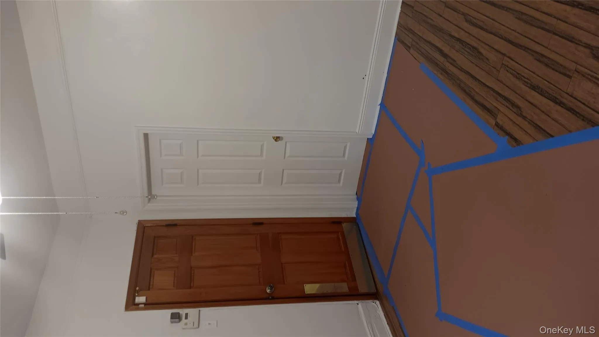 Spare room featuring baseboards and wood finished floors Spare room featuring baseboards and wood finished floors