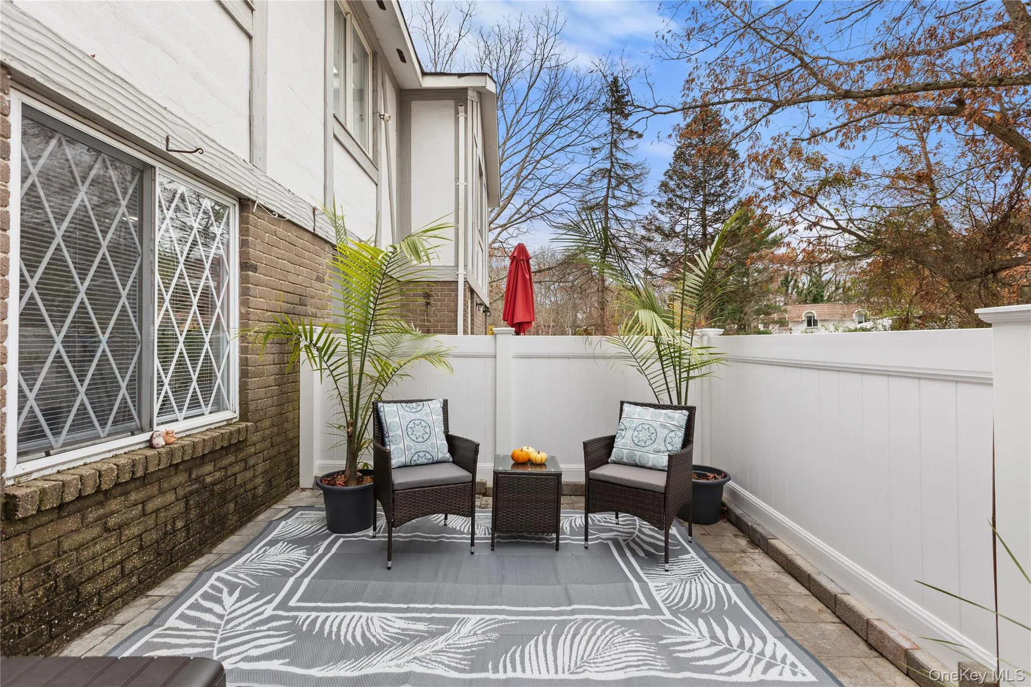 Fenced backyard featuring a patio area Fenced backyard featuring a patio area
