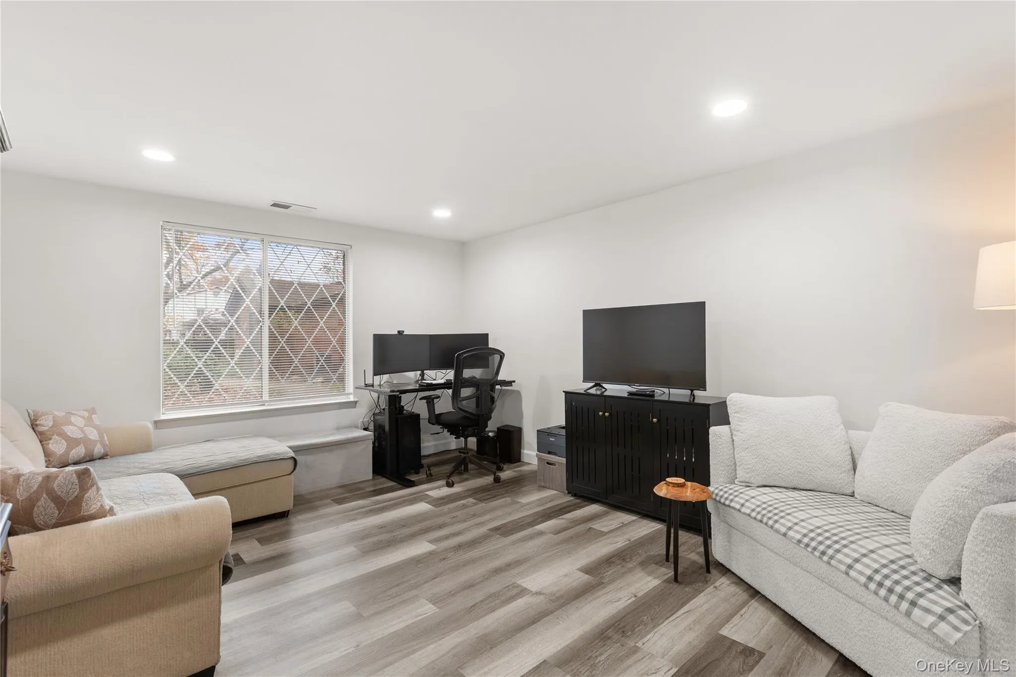 Office space featuring light wood finished floors and recessed lighting Office space featuring light wood finished floors and recessed lighting