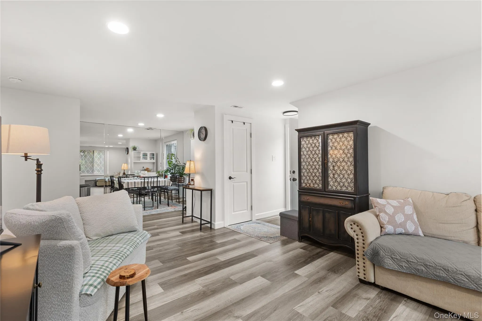 Living room with recessed lighting and wood finished floors Living room with recessed lighting and wood finished floors