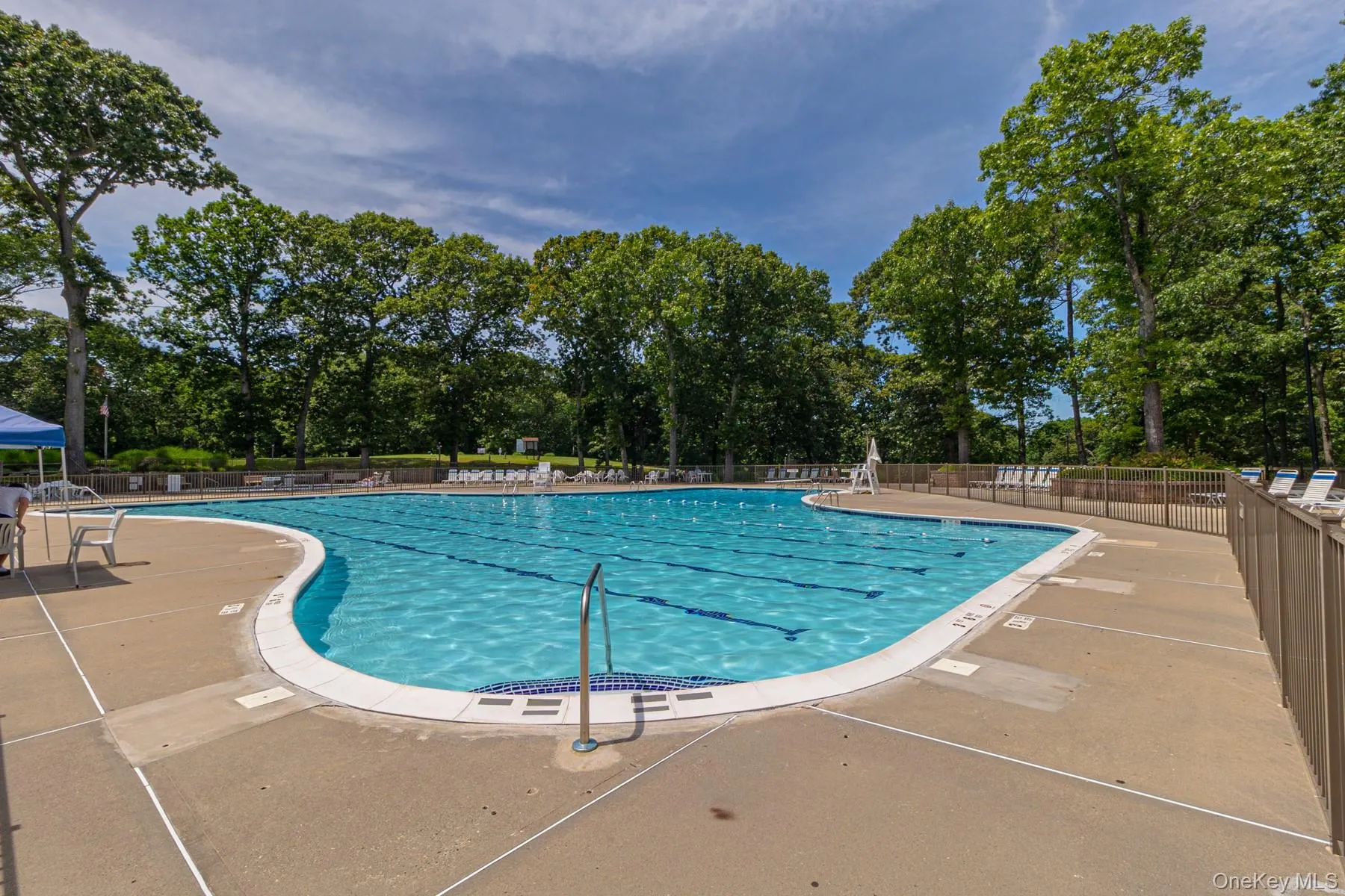 Community pool with a patio Community pool with a patio