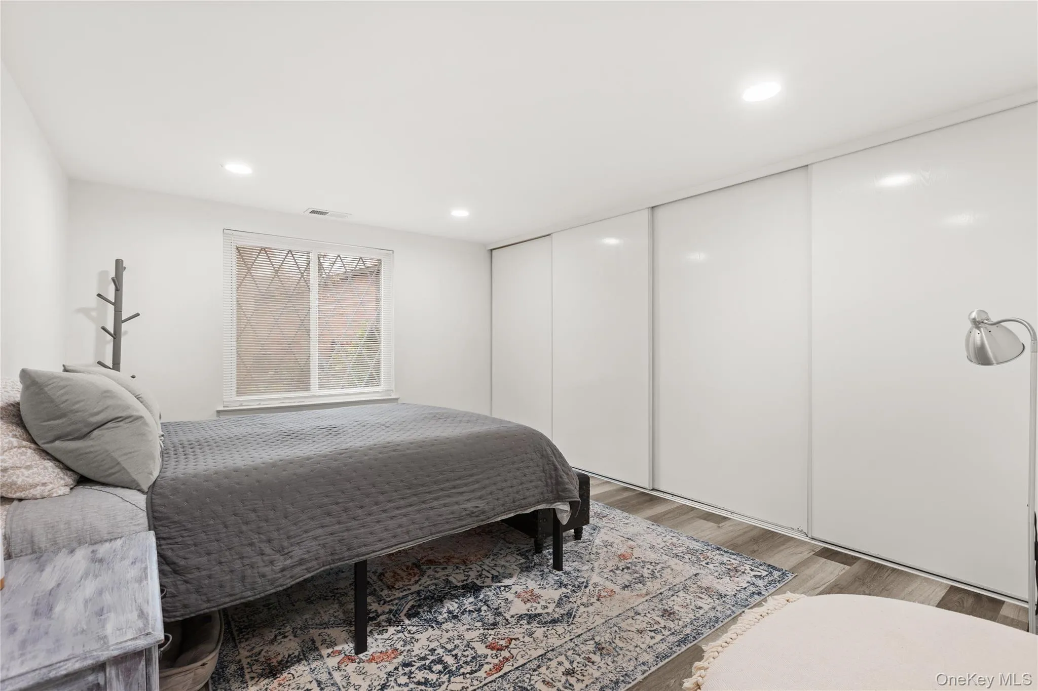 Bedroom featuring wood finished floors and recessed lighting Bedroom featuring wood finished floors and recessed lighting