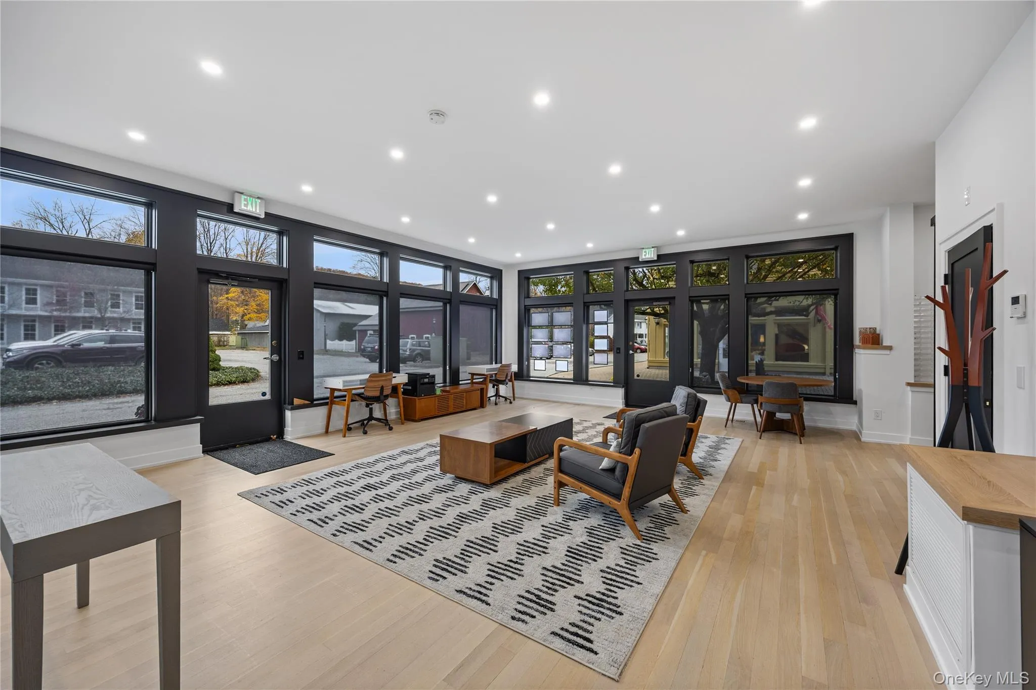 Living room featuring light wood-style flooring and recessed lighting Living room featuring light wood-style flooring and recessed lighting