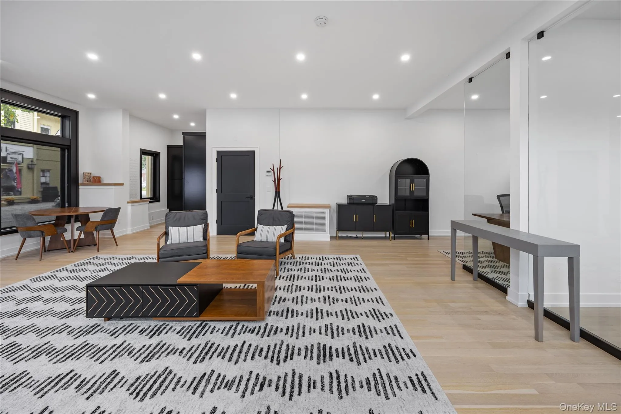 Living room featuring recessed lighting and light wood-style flooring Living room featuring recessed lighting and light wood-style flooring
