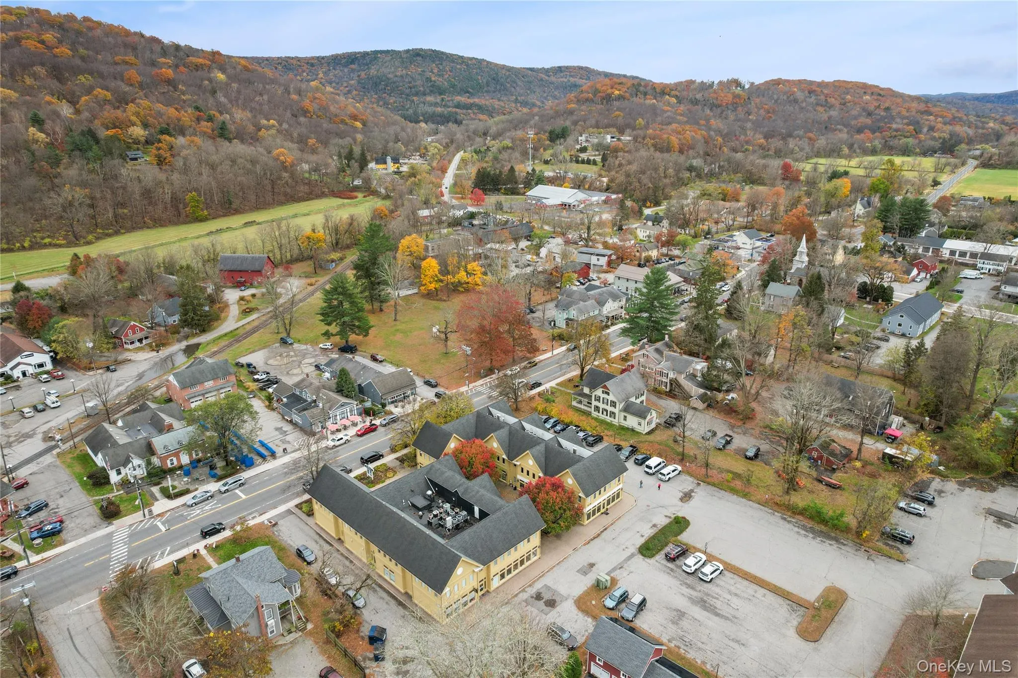 Aerial view of property's location with nearby suburban area and a mountain backdrop Aerial view of property's location with nearby suburban area and a mountain backdrop