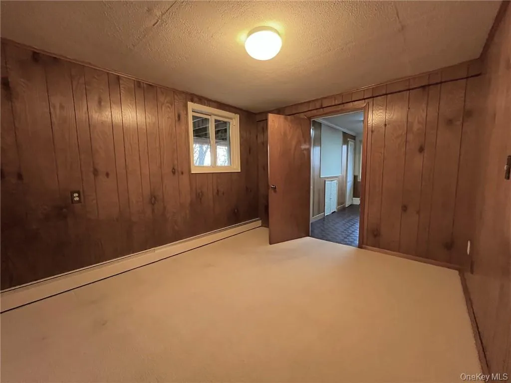 Bedroom with wood paneling Bedroom with wood paneling
