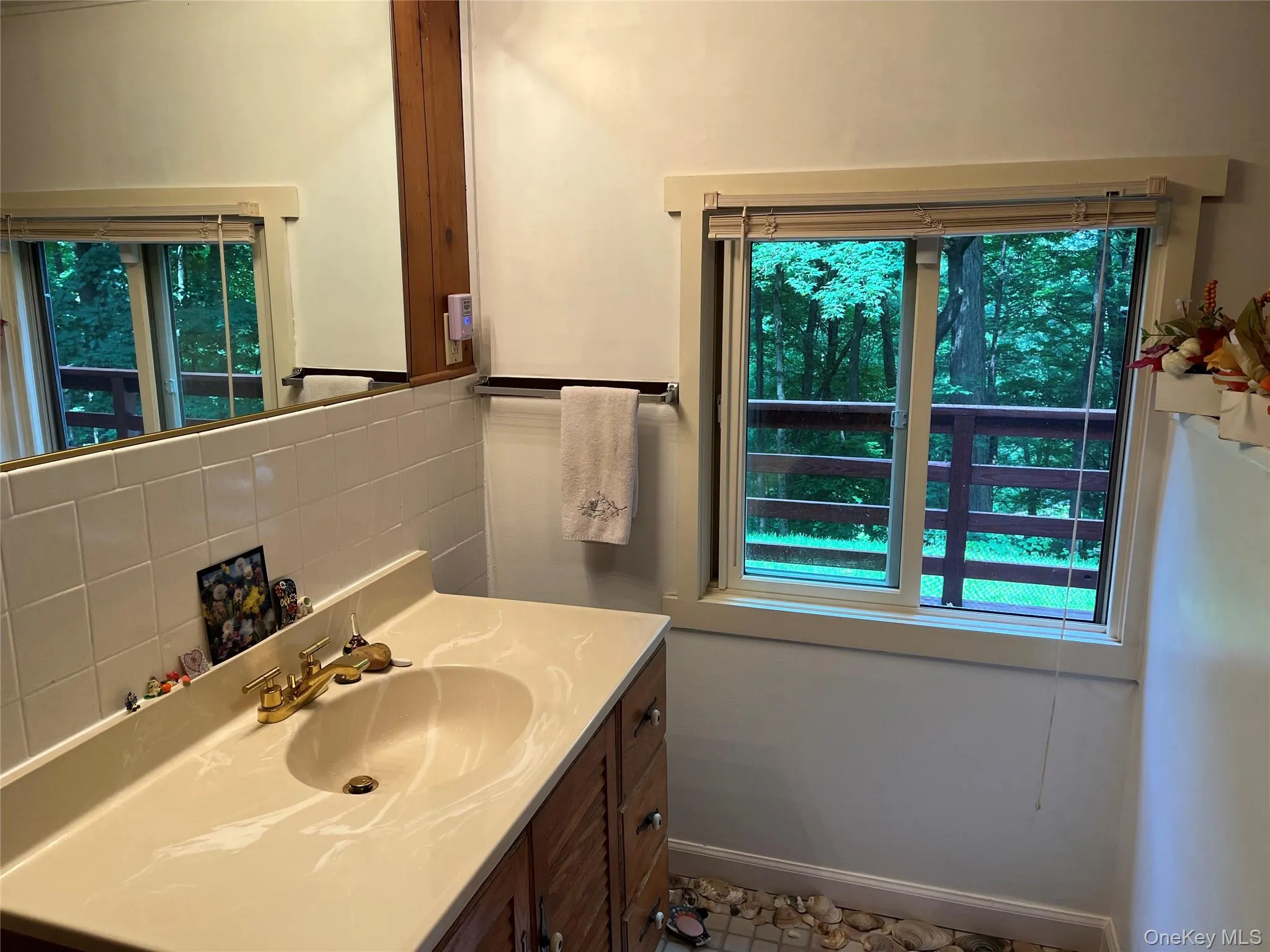 Bathroom featuring vanity and stall shower Bathroom featuring vanity and stall shower