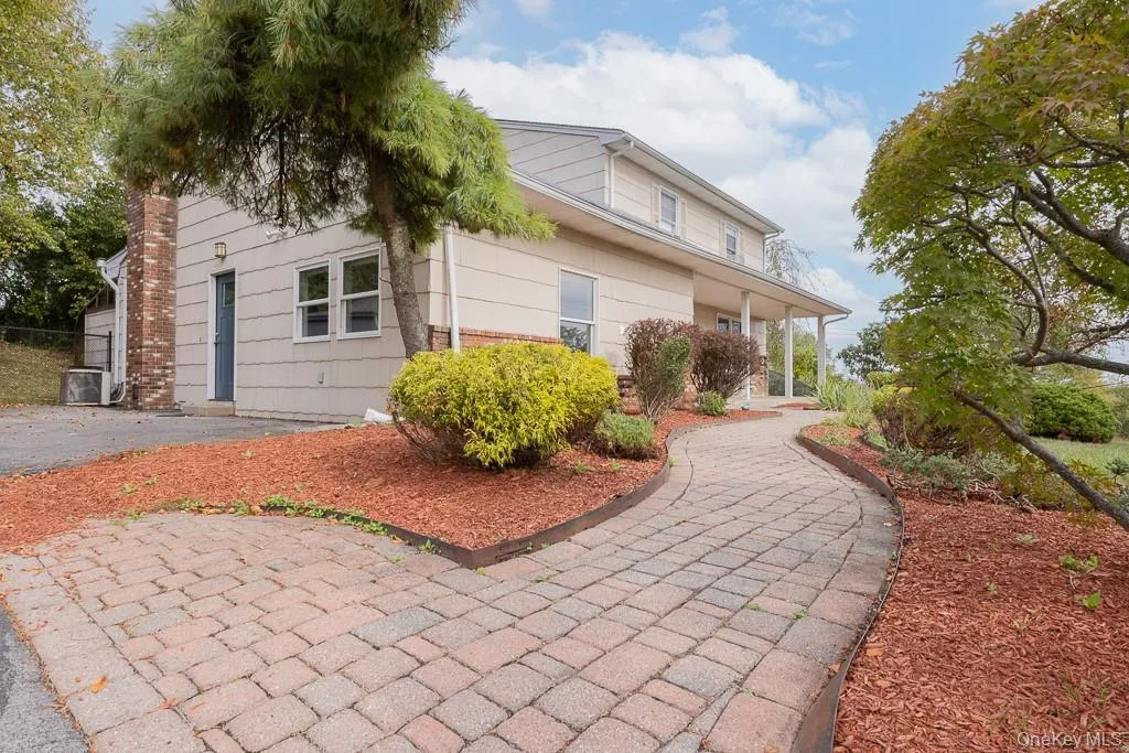 View of home's exterior featuring a central AC unit and covered porch View of home's exterior featuring a central AC unit and covered porch