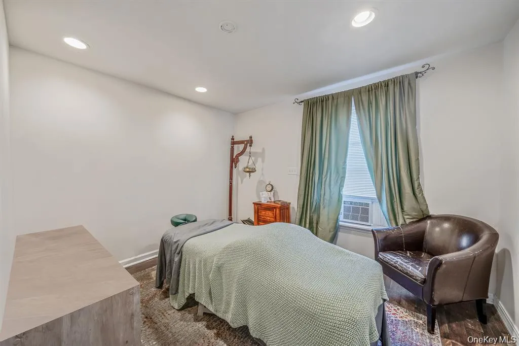 Bedroom featuring recessed lighting and cooling unit Bedroom featuring recessed lighting and cooling unit