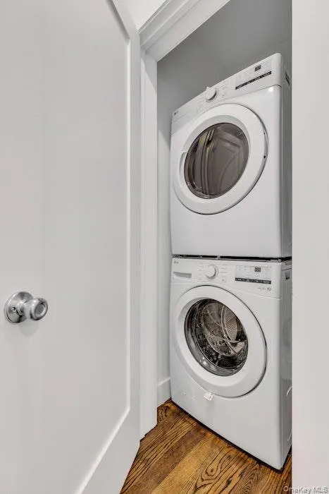 Laundry area featuring stacked unit Laundry area featuring stacked unit