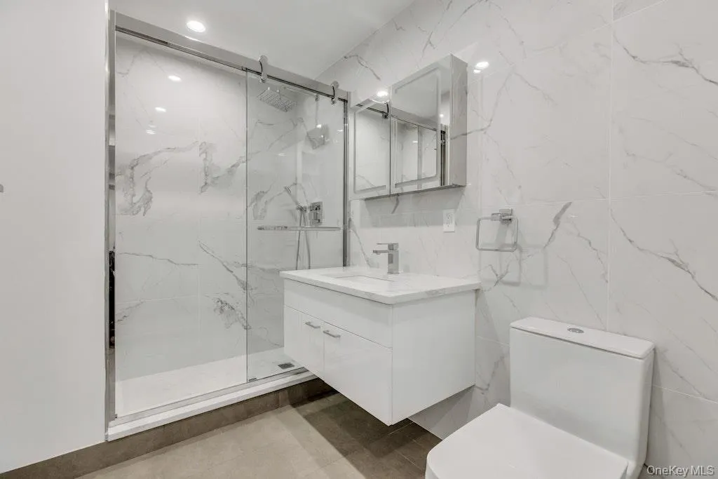 Hall bathroom with floating vanity and shower Hall bathroom with floating vanity and shower