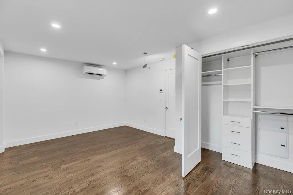 Bedroom with outfitted closet Bedroom with outfitted closet