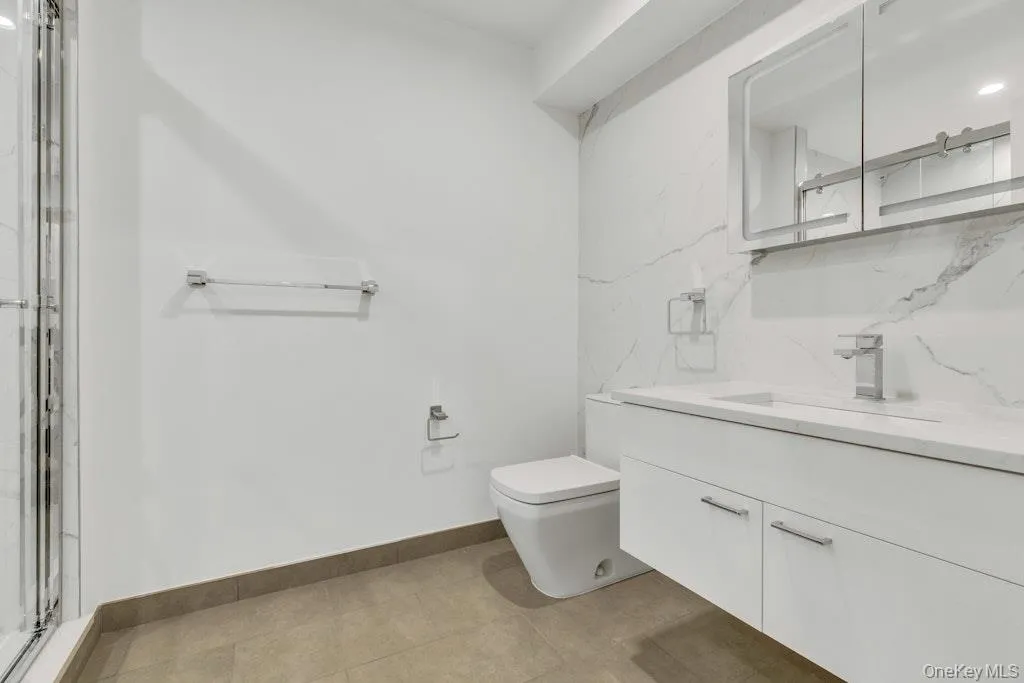 Bathroom featuring floating vanity Bathroom featuring floating vanity