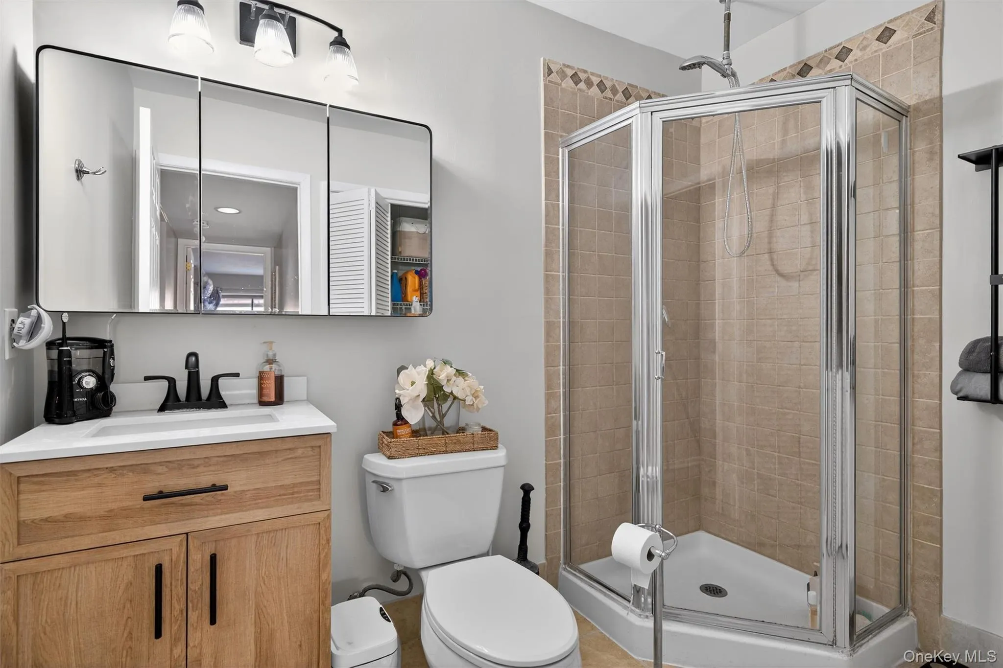 Full bath with a stall shower and vanity Full bath with a stall shower and vanity