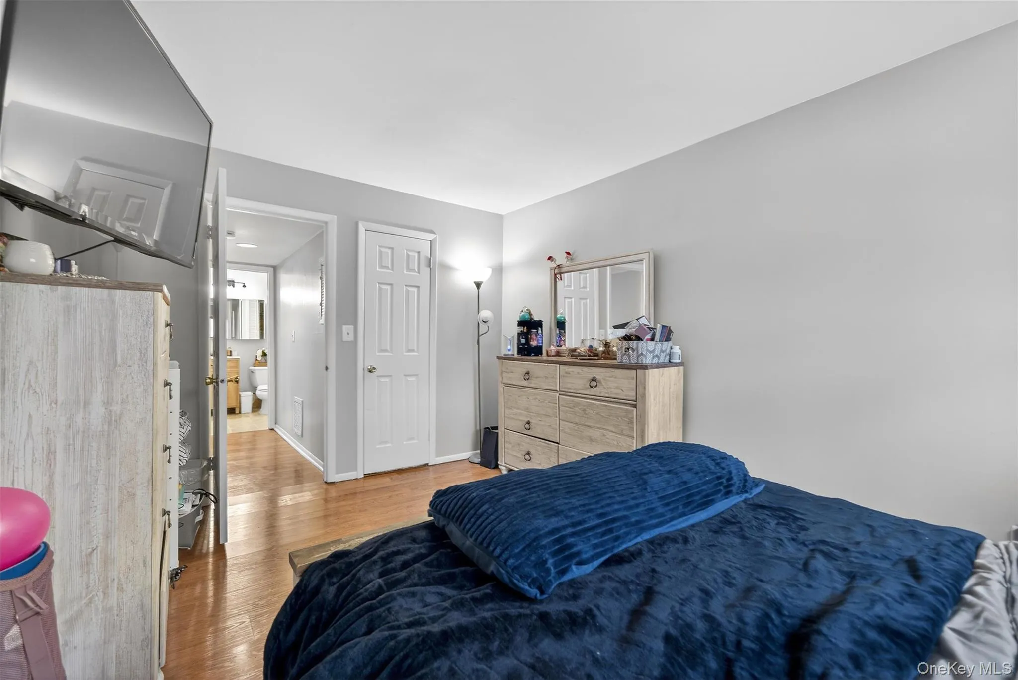 Bedroom with light wood-style floors and baseboards Bedroom with light wood-style floors and baseboards