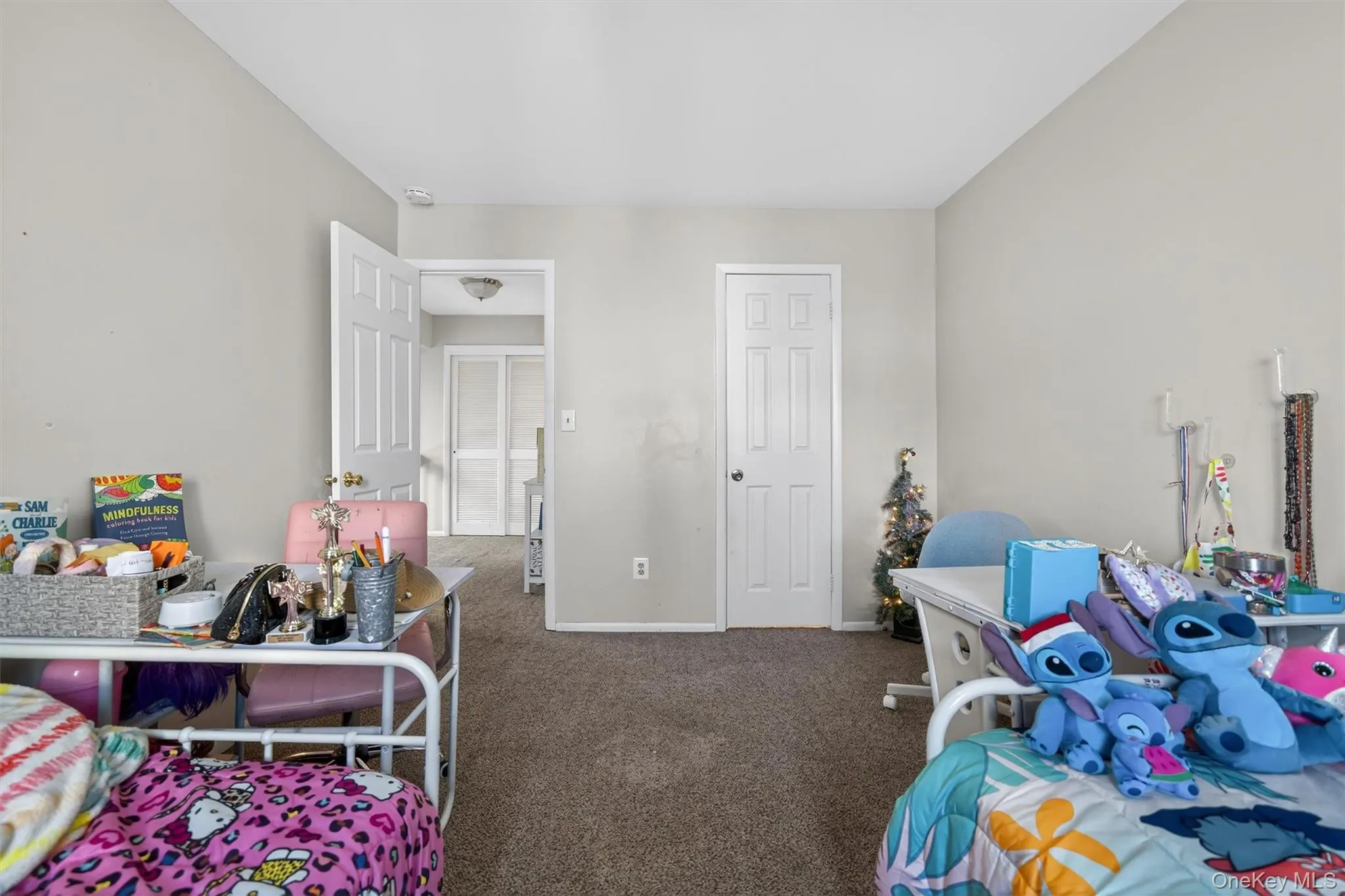 Bedroom featuring carpet flooring and baseboards Bedroom featuring carpet flooring and baseboards