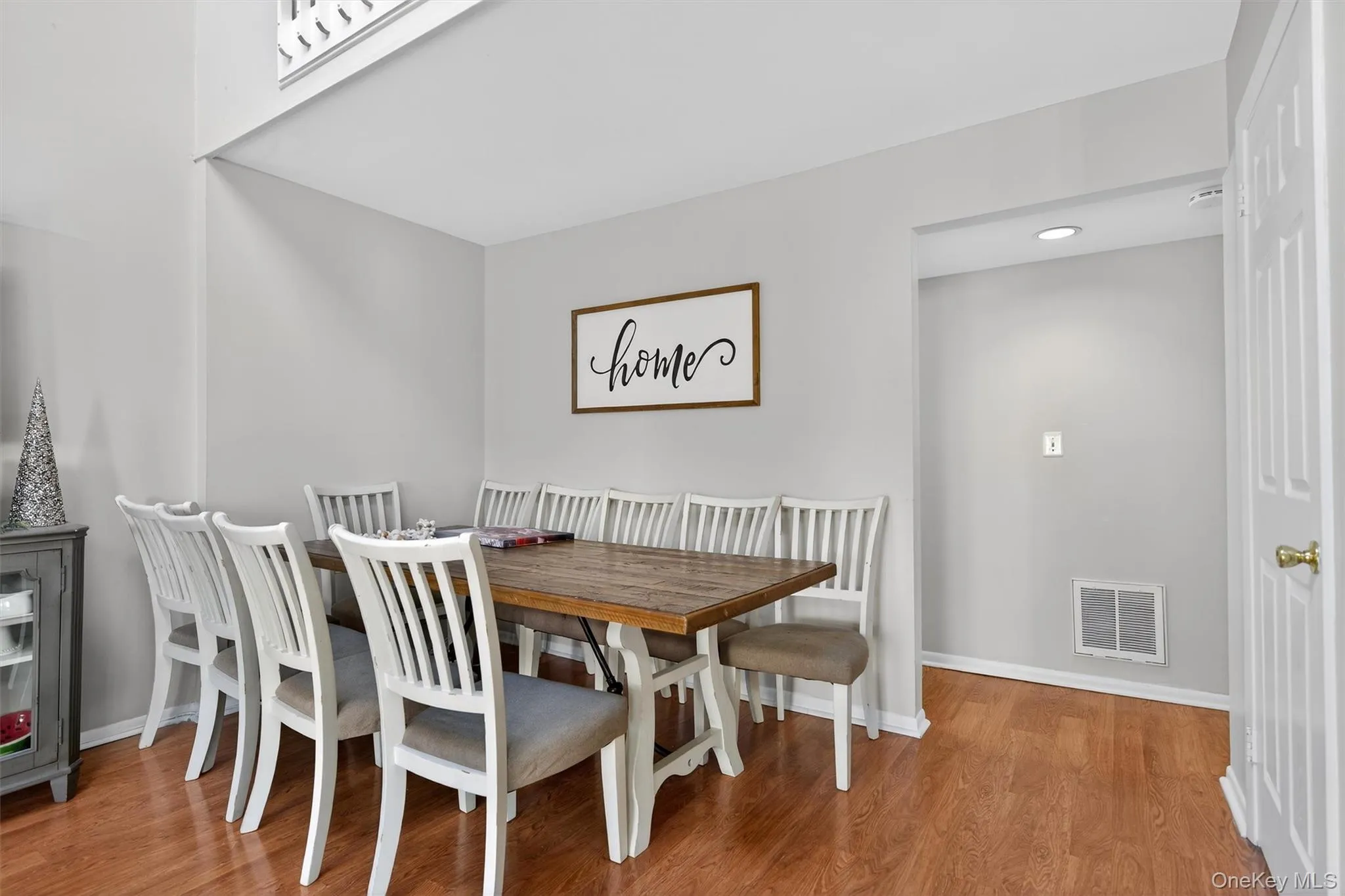 Dining area featuring light wood-style floors and baseboards Dining area featuring light wood-style floors and baseboards