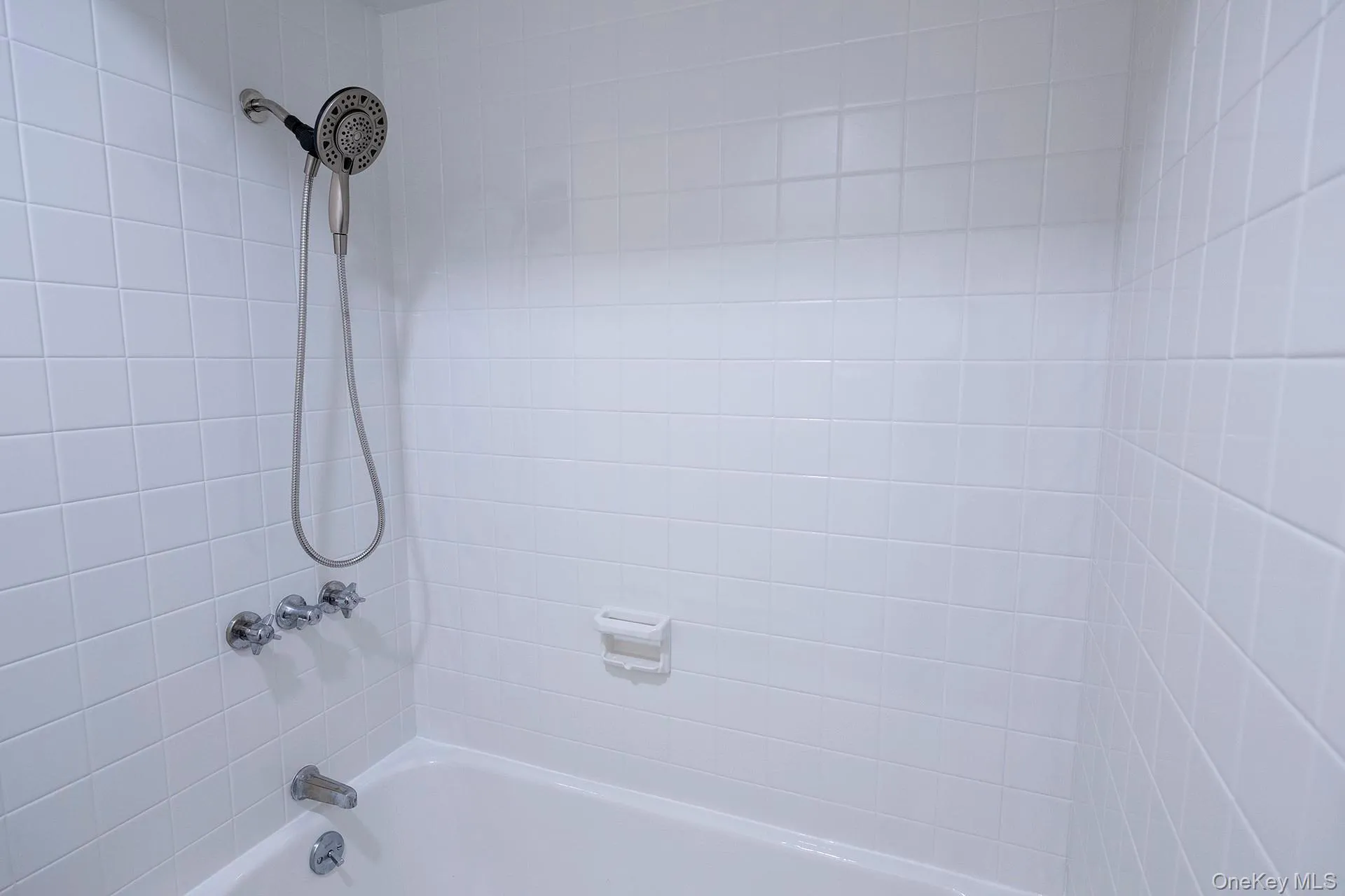 Full bathroom featuring shower / tub combination Full bathroom featuring shower / tub combination