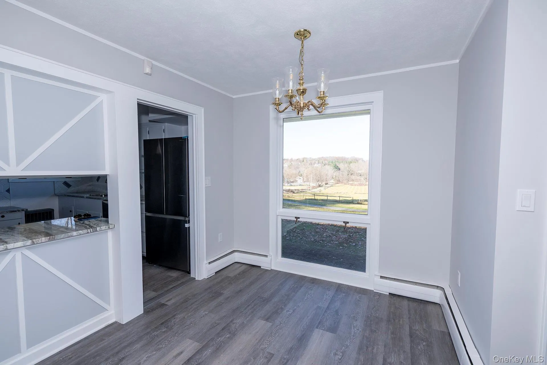 Dining area with long window taking in view of the property Dining area with long window taking in view of the property