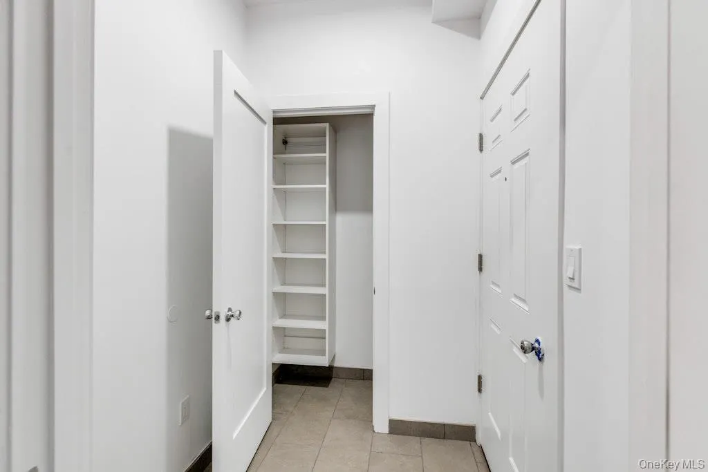 Closed off foyer with coat outfitted closet Closed off foyer with coat outfitted closet