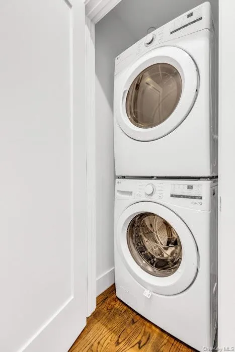 Laundry area featuring stacked washer/dryer Laundry area featuring stacked washer/dryer