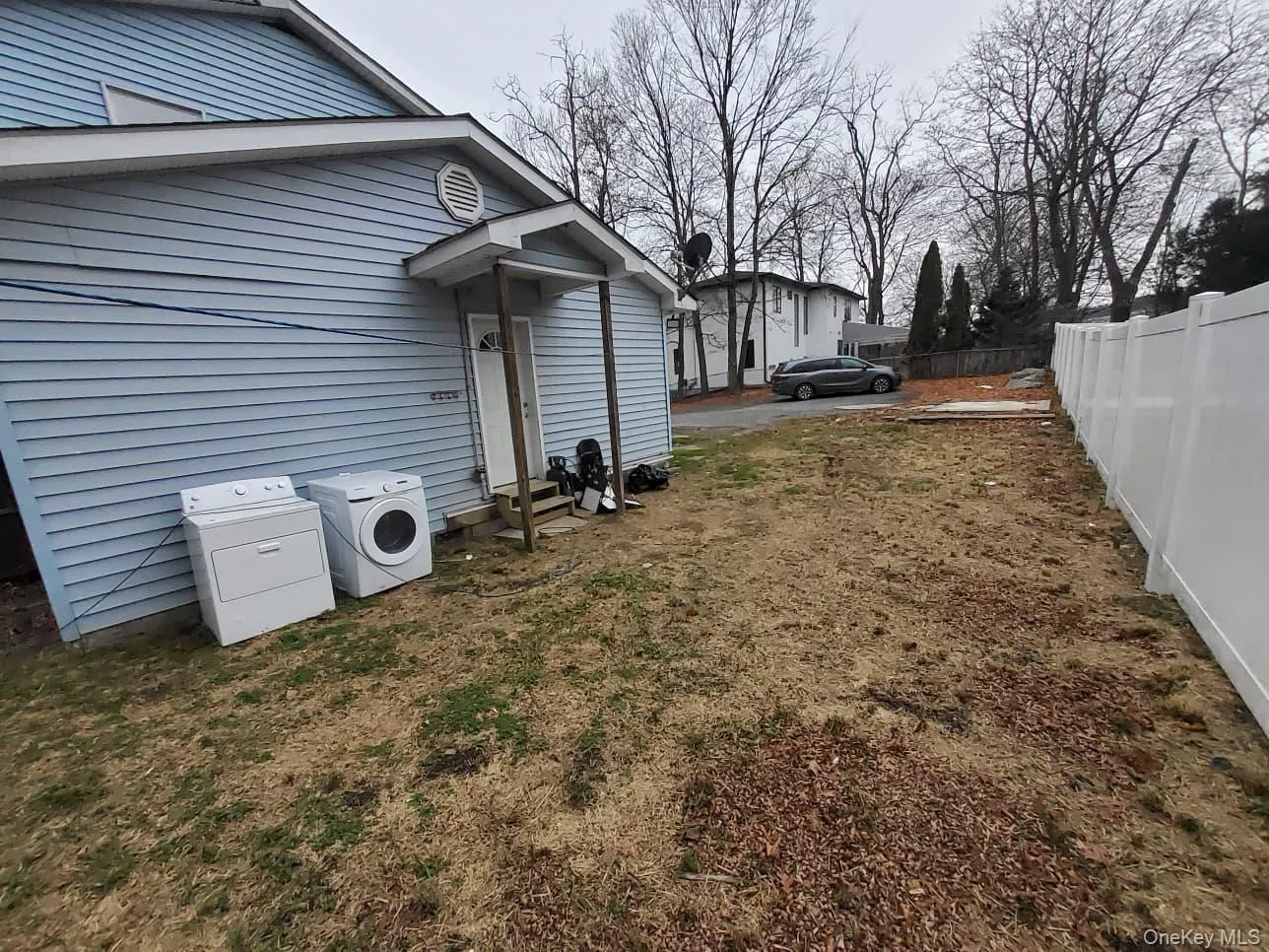View of yard featuring washer and dryer View of yard featuring washer and dryer
