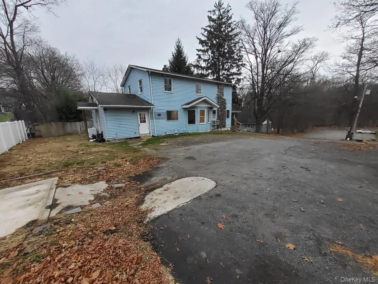 View of front of property with driveway and a patio View of front of property with driveway and a patio