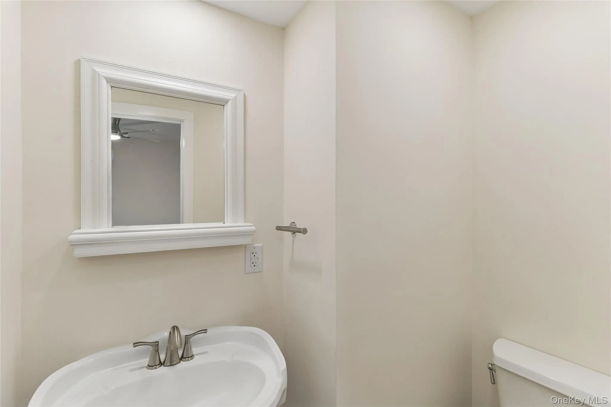 Half bath with a sink and toilet Half bath with a sink and toilet