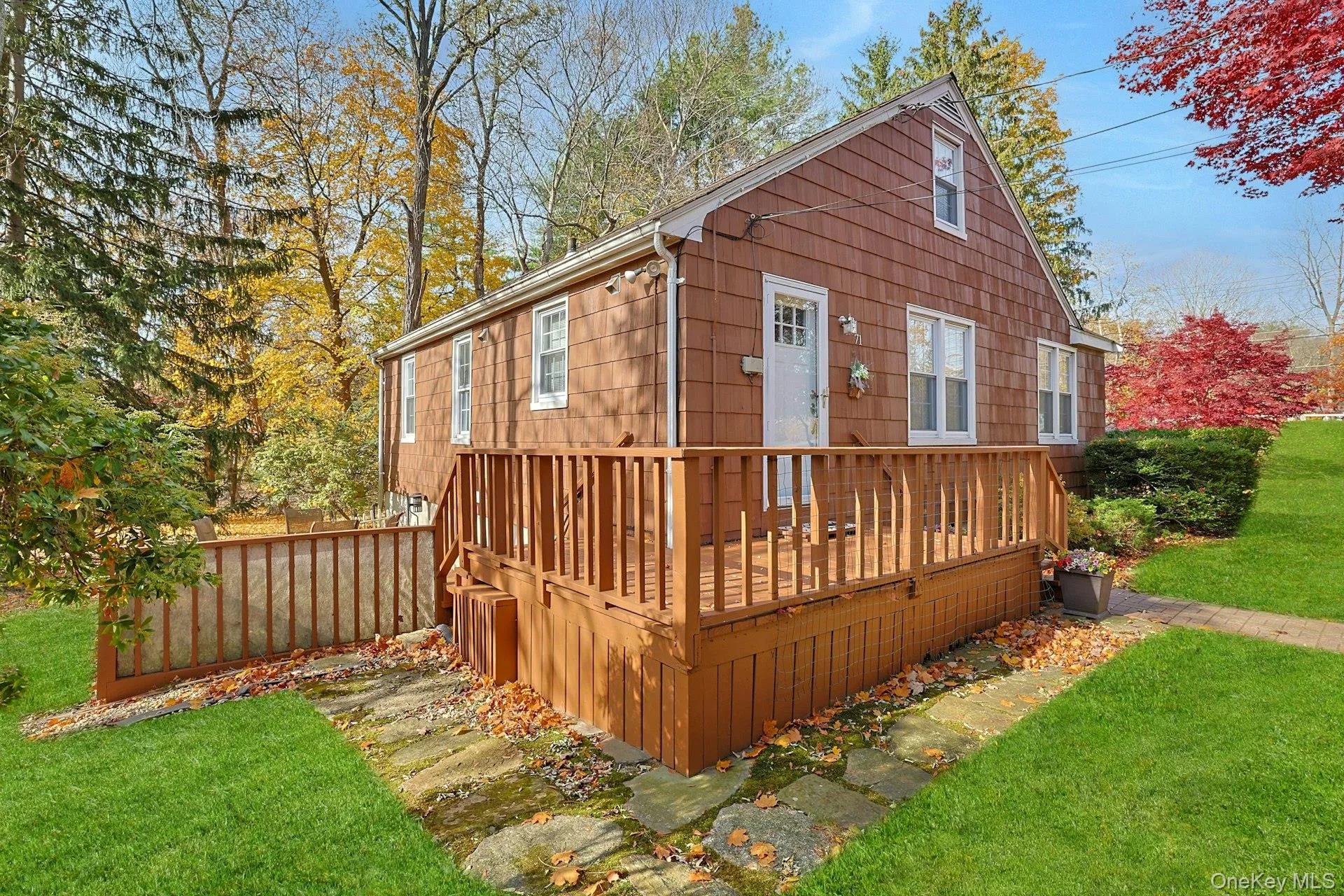 Side of house with a deck Side of house with a deck