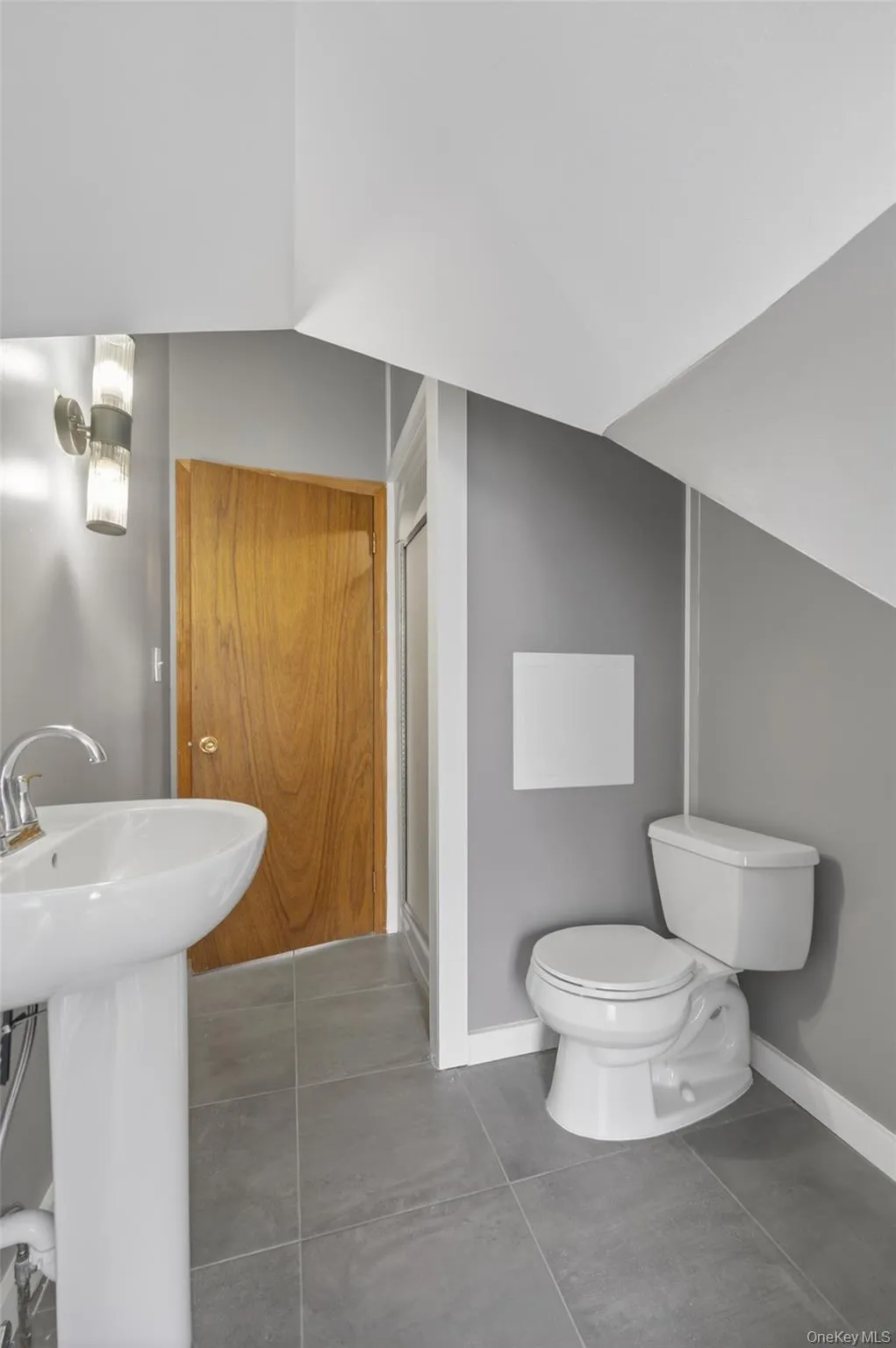 Bathroom with a shower stall and toilet Bathroom with a shower stall and toilet