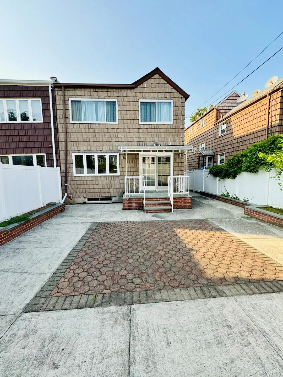 Rear view of house featuring a patio area Rear view of house featuring a patio area