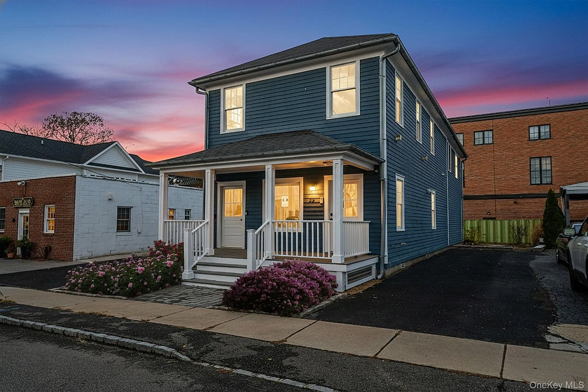 American foursquare style home featuring covered porch American foursquare style home featuring covered porch
