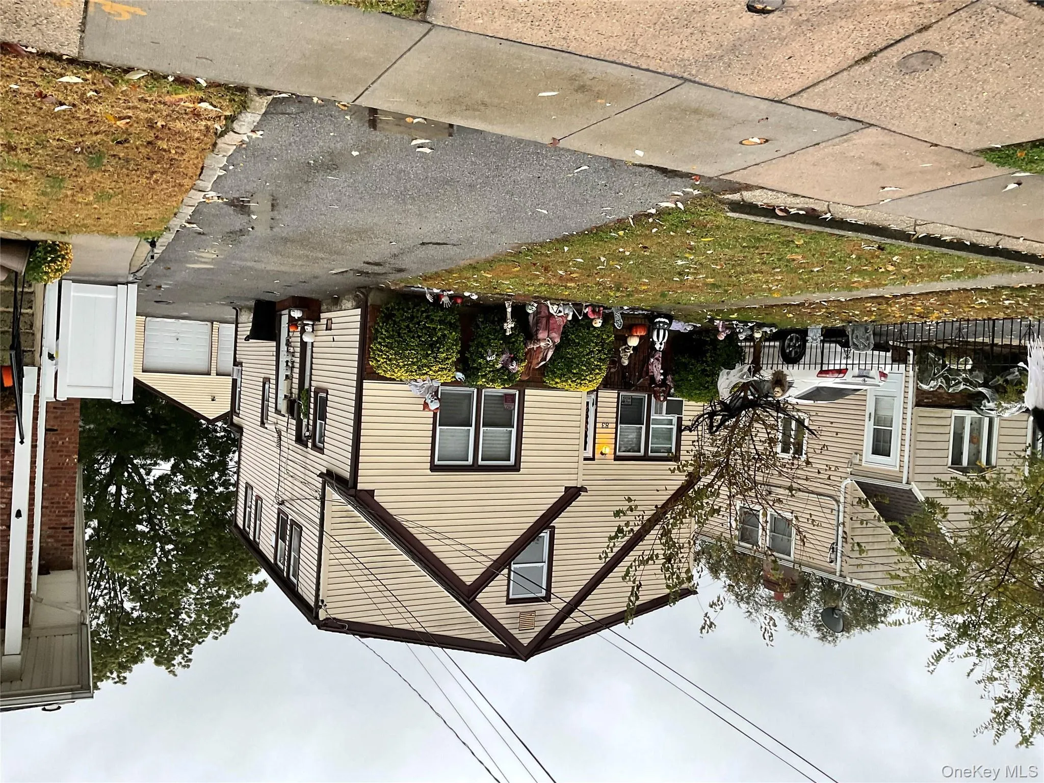 View of front facade with an outdoor structure and a detached garage View of front facade with an outdoor structure and a detached garage