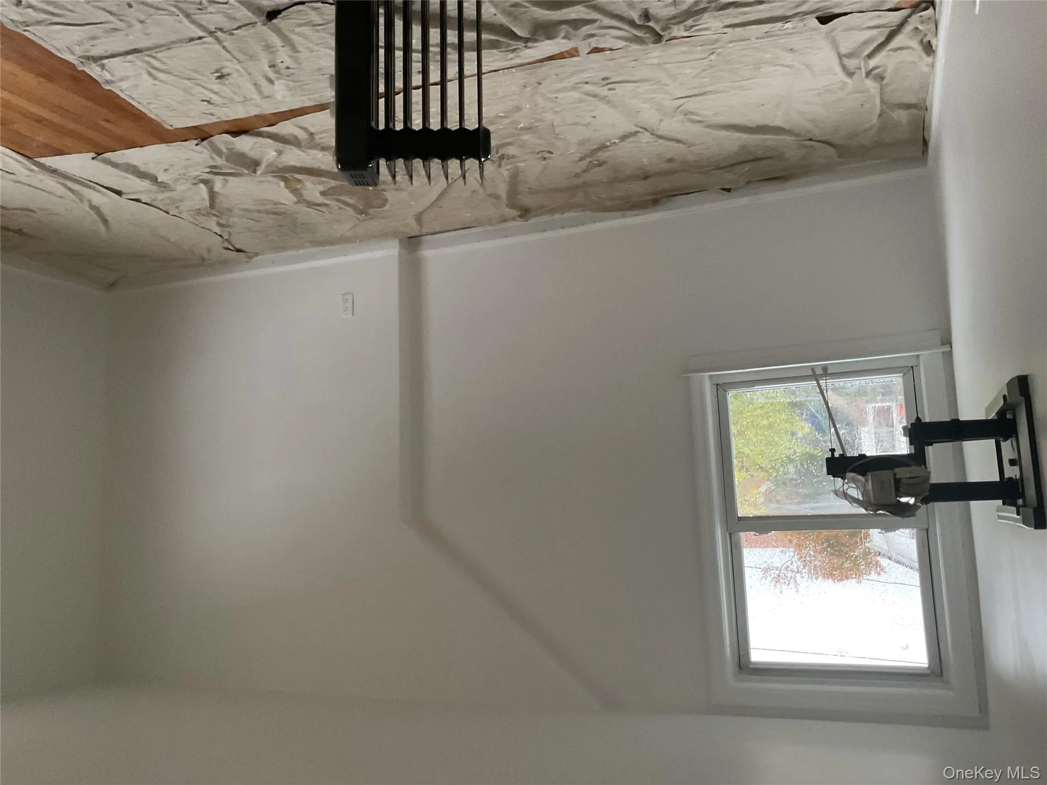 Additional living space with wood finished floors and baseboards Additional living space with wood finished floors and baseboards