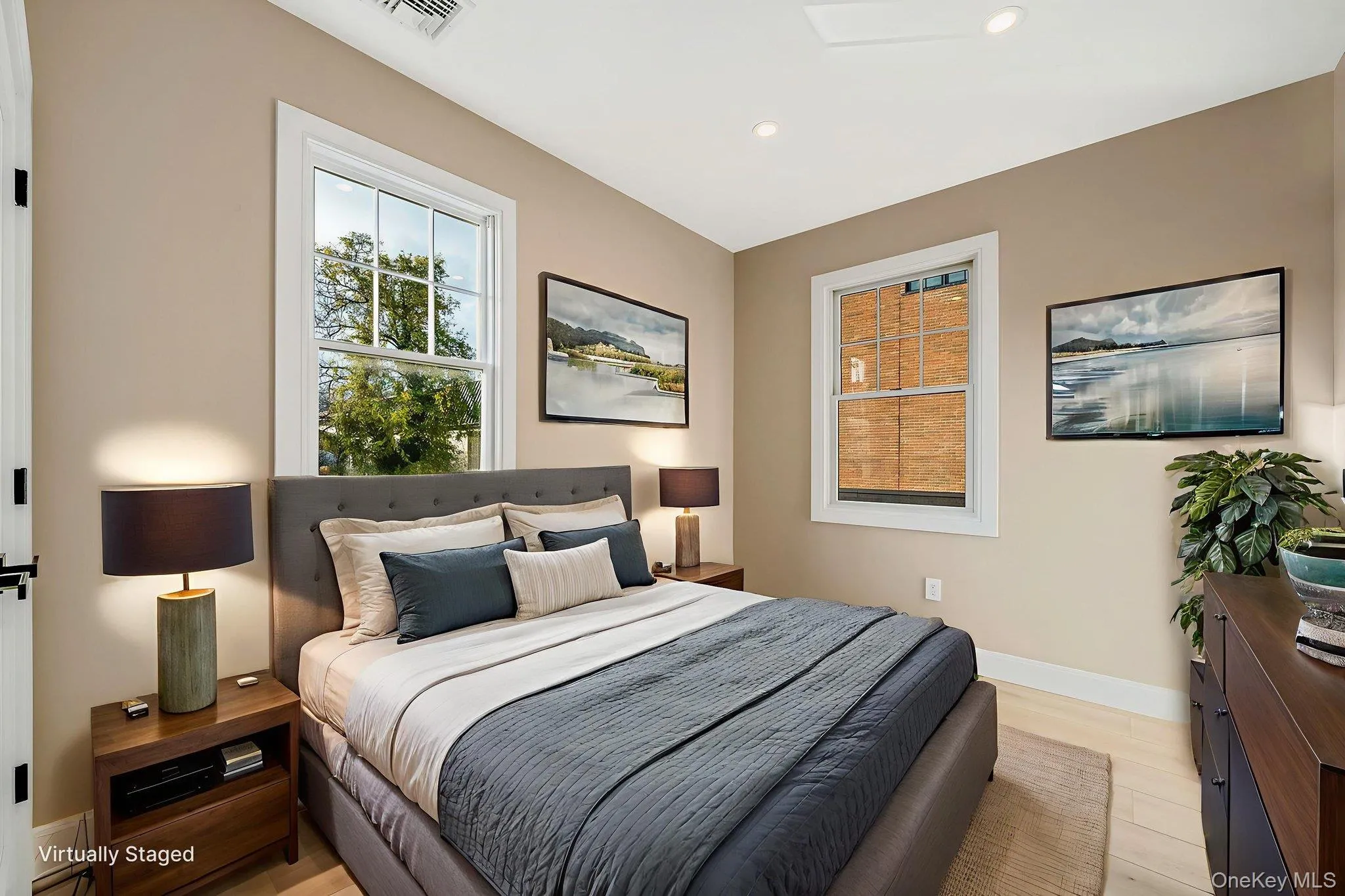 Bedroom with light wood-style flooring and recessed lighting Bedroom with light wood-style flooring and recessed lighting