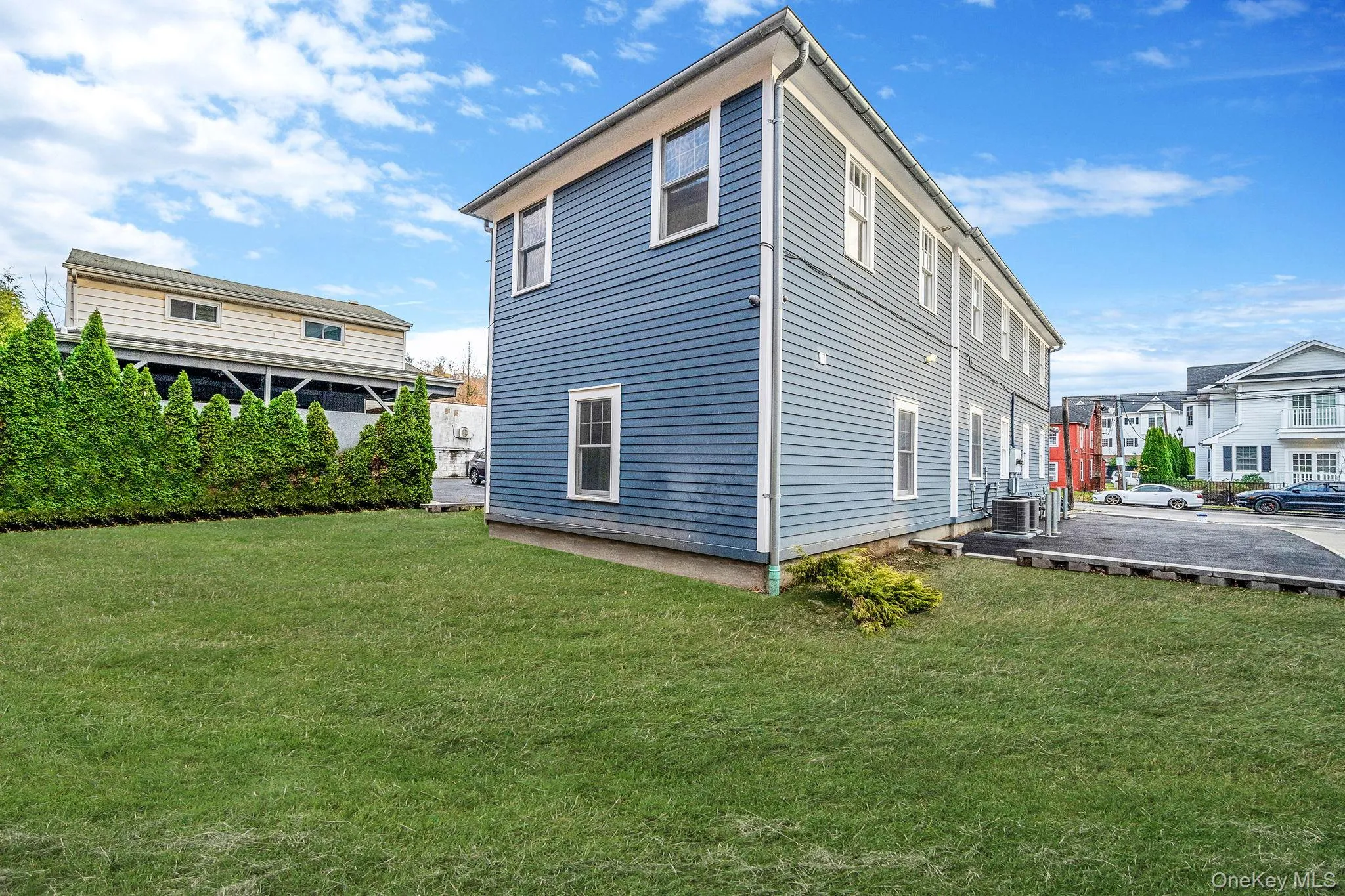 Rear view of property with a lawn Rear view of property with a lawn