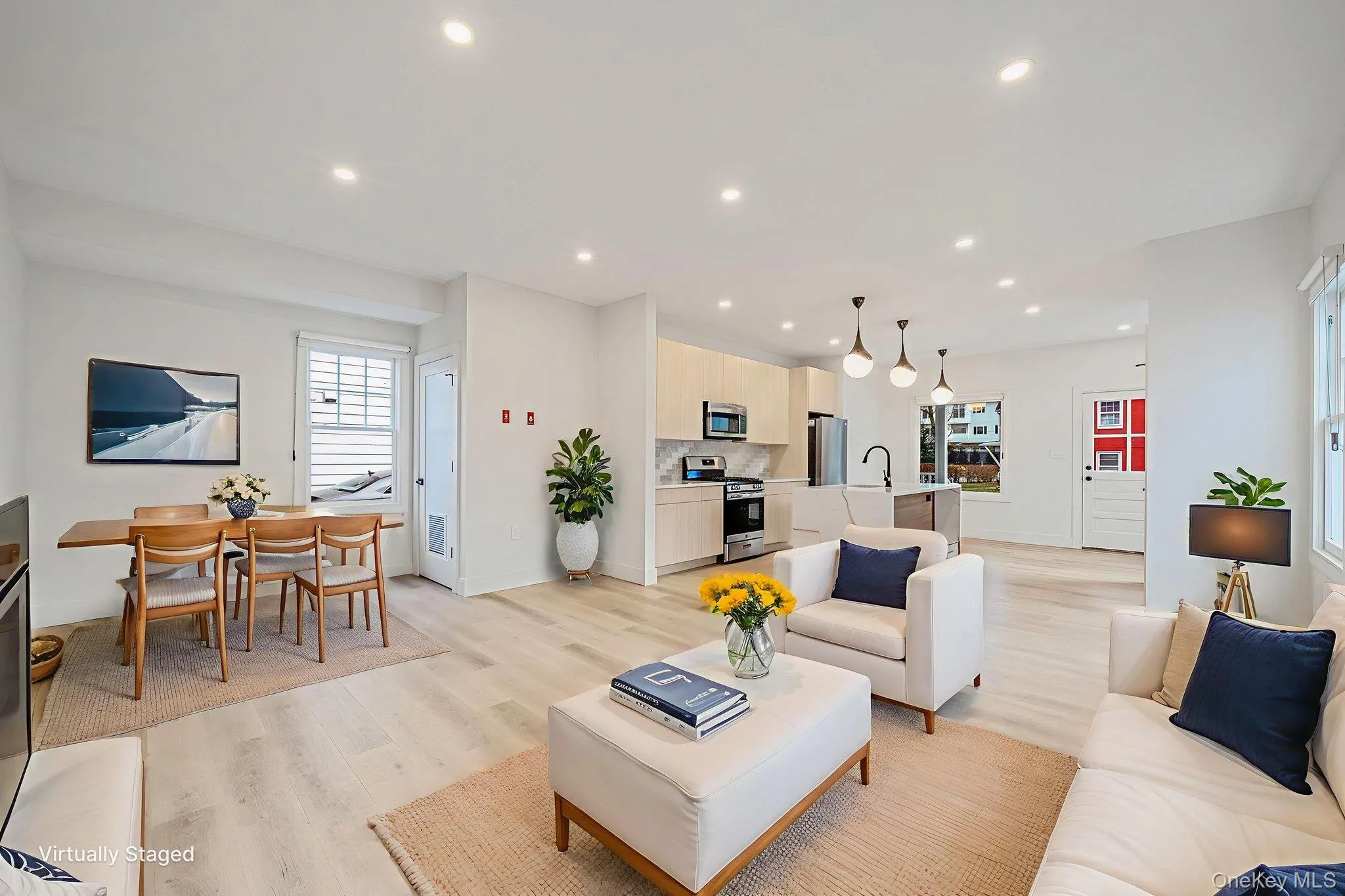 Living room featuring light wood-style flooring and recessed lighting Living room featuring light wood-style flooring and recessed lighting