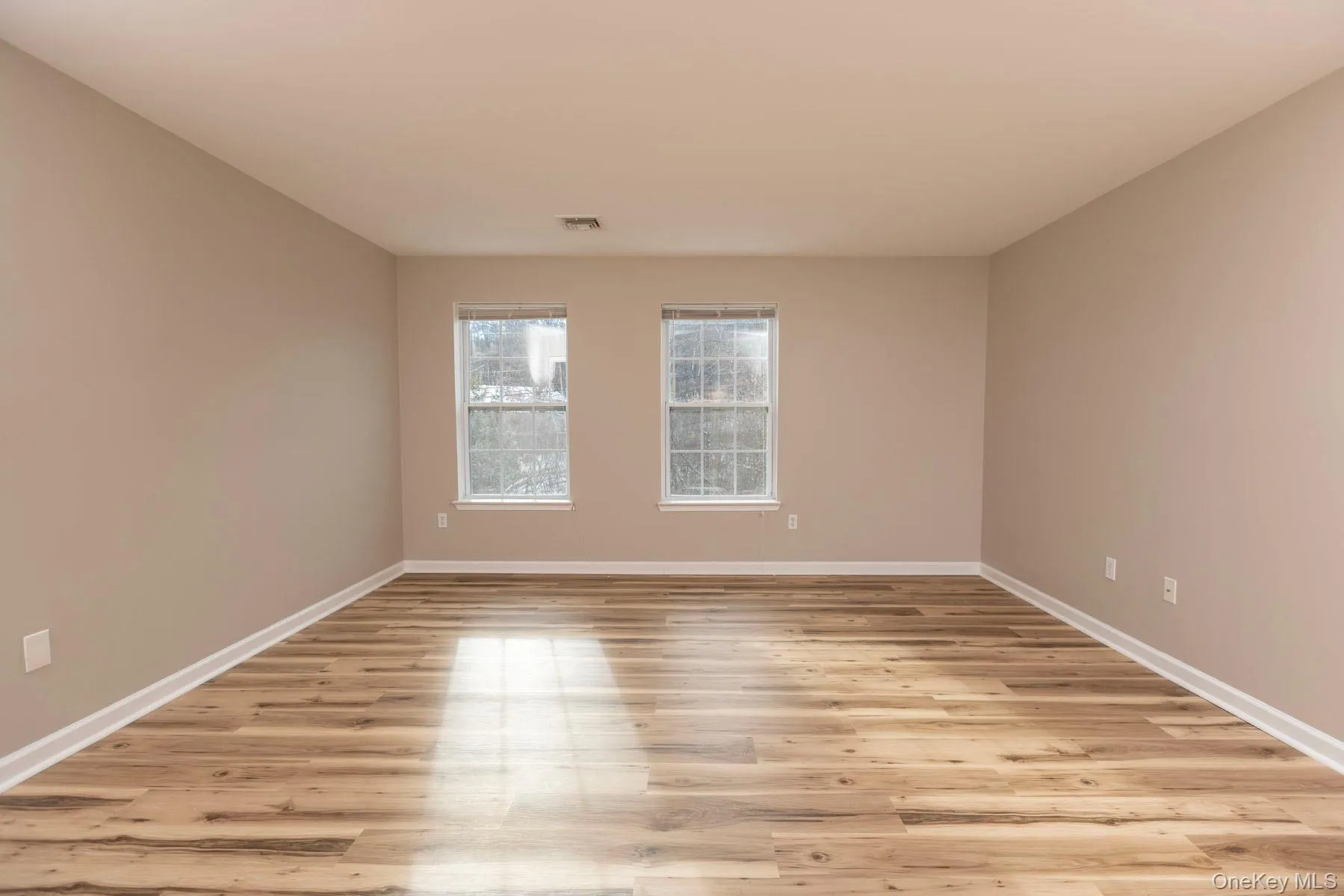 Empty room featuring light wood-style floors Empty room featuring light wood-style floors