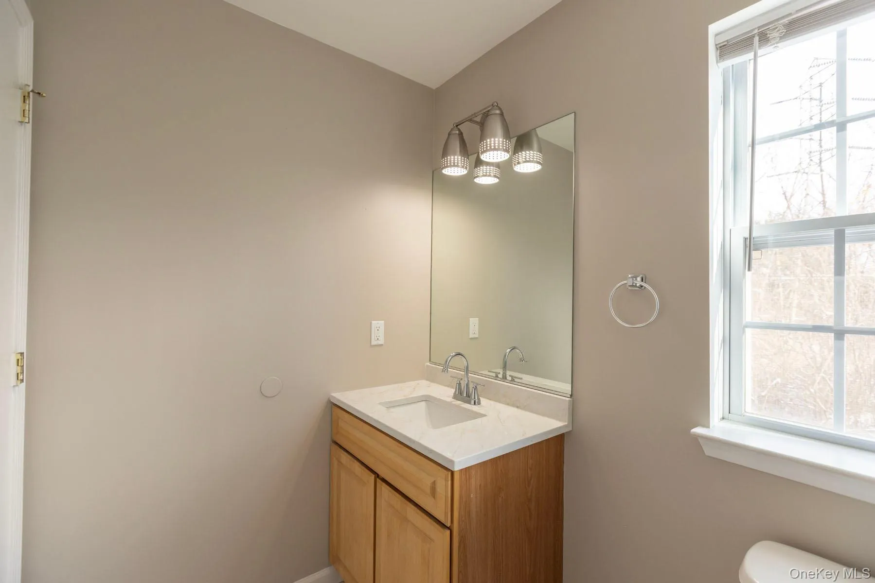 Bathroom with plenty of natural light and vanity Bathroom with plenty of natural light and vanity