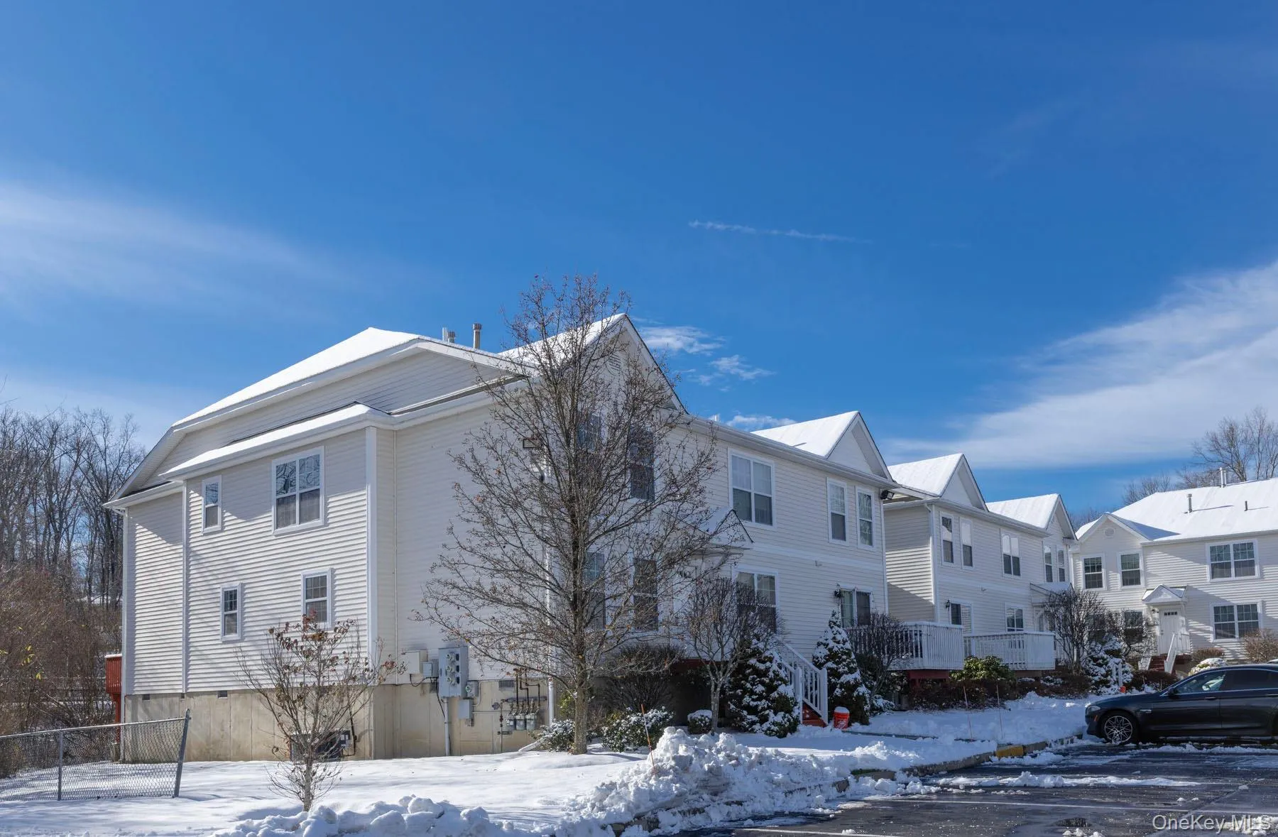 Snow covered property with a residential view Snow covered property with a residential view