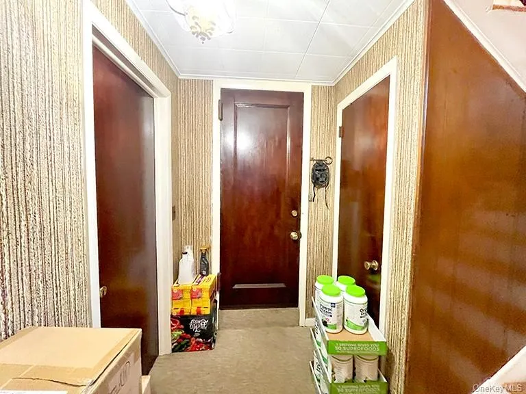 Hall featuring carpet flooring Hall featuring carpet flooring