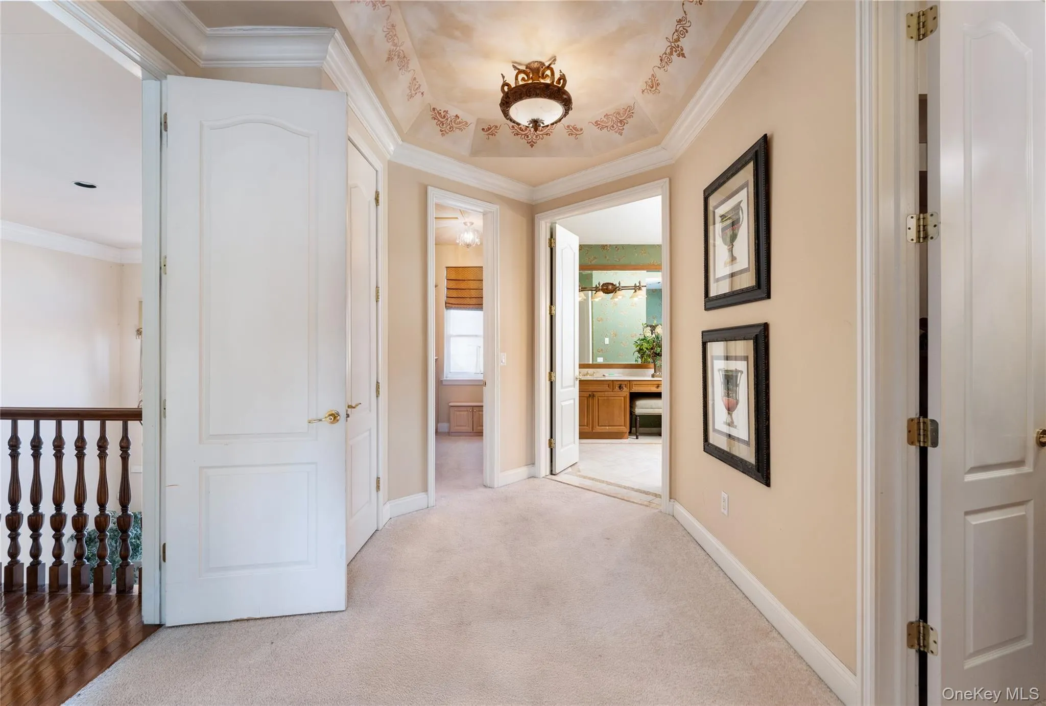 Hall with ornamental molding and carpet floors Hall with ornamental molding and carpet floors