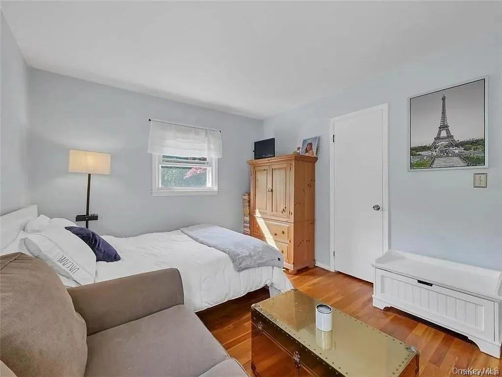 Bedroom with wood-type flooring Bedroom with wood-type flooring