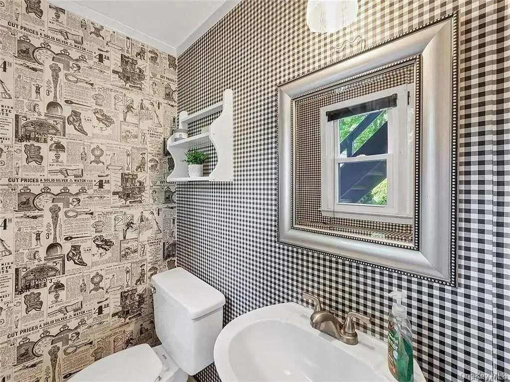 Bathroom with toilet and sink Bathroom with toilet and sink