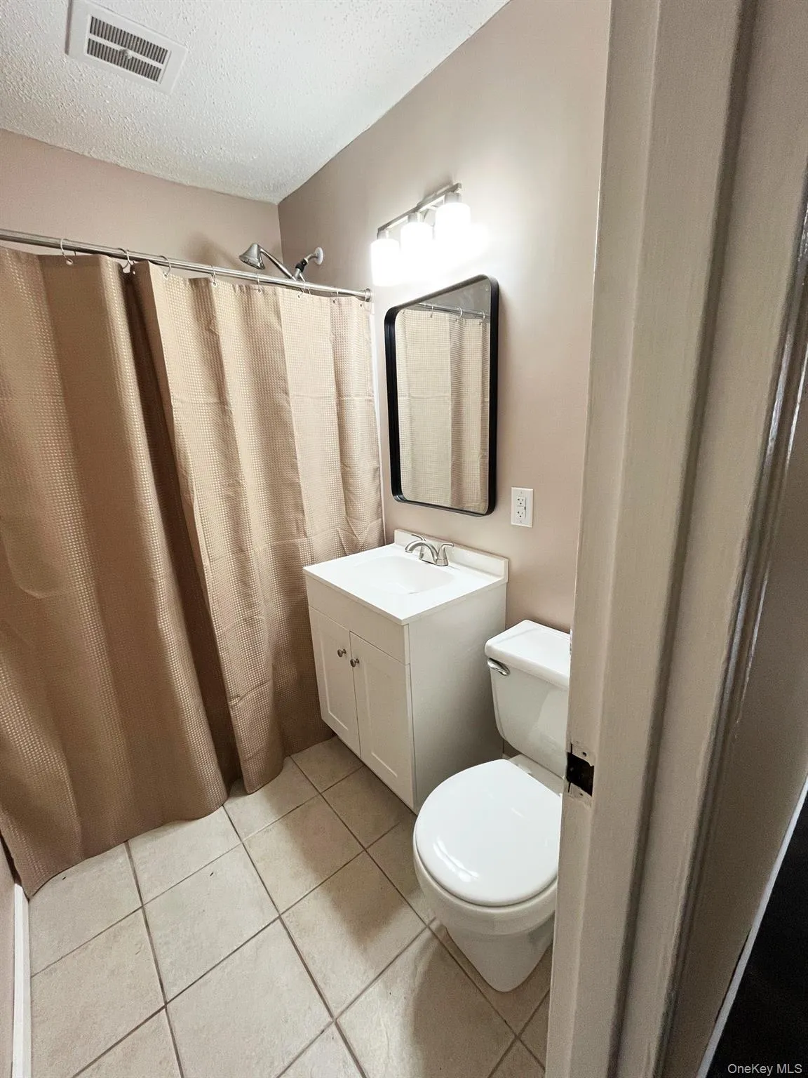 Pristine tile flooring in the bathroom. Pristine tile flooring in the bathroom.
