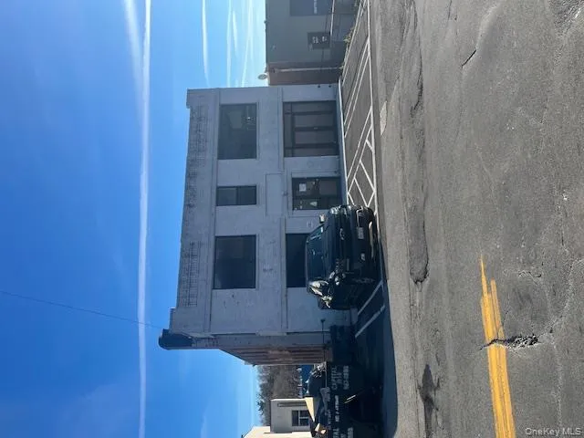 View of property featuring uncovered parking View of property featuring uncovered parking
